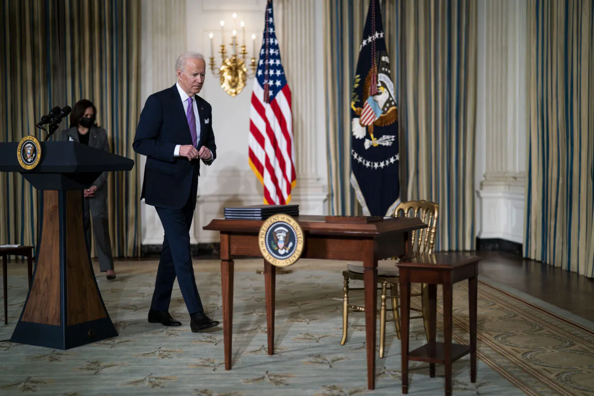 President Joe Biden prepares to sign executive orders related to his racial equity agenda in the State Dining Room of the White House on Jan. 26, 2021. (Doug Mills/Pool/Getty Images)