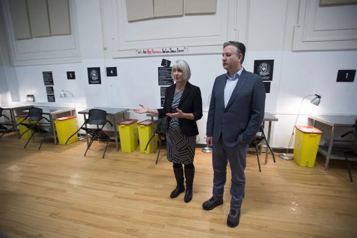 Federal Health Minister Patty Hajdu and Vancouver Mayor Kennedy Stewart speak to the media during a visit to the Molson Overdose Prevention Site in Vancouver's Downtown Eastside on Jan. 16, 2020. (Jonathan Hayward/The Canadian Press)