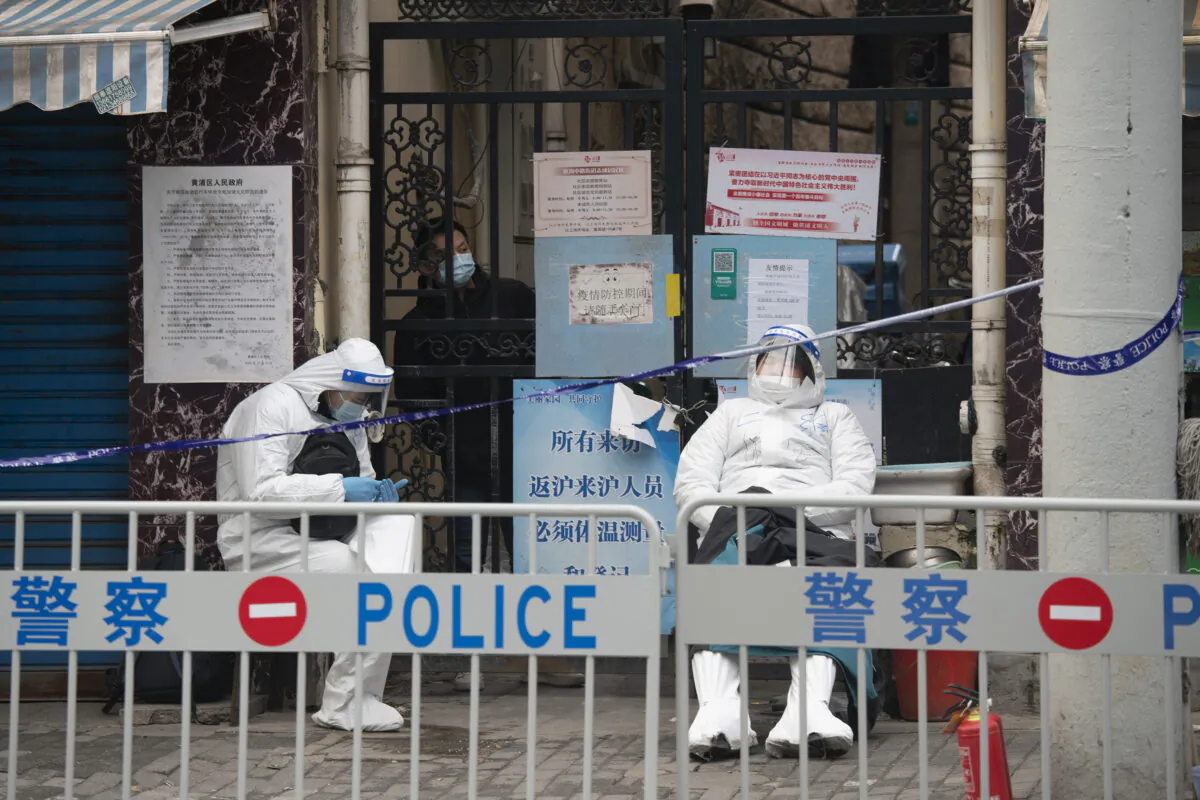 Health workers in protective suits are seen in the Huangpu district in Shanghai, China, on Jan. 28, 2021. (Hu Chengwei/Getty Images)