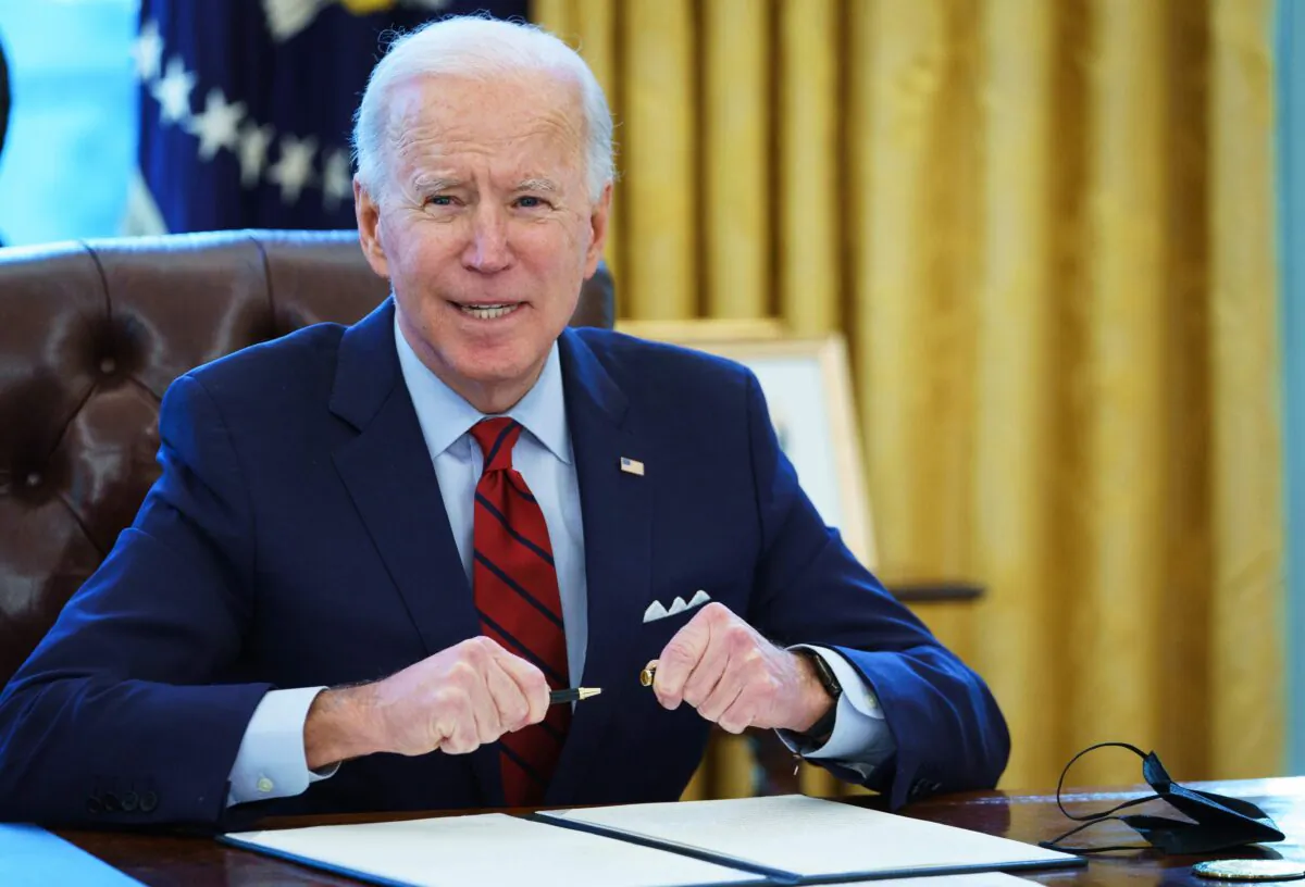 President Joe Biden prepares to sign executive orders in the White House in Washington on Jan. 28, 2021. (Mandel Ngan/AFP via Getty Images)