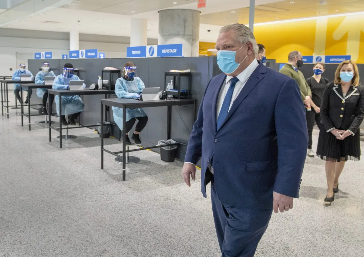 Ontario Premier Doug Ford walks through the COVID-19 testing centre in the International Arrivals section at Pearson Airport in Toronto on Jan. 26, 2021. (Frank Gunn/The Canadian Press)