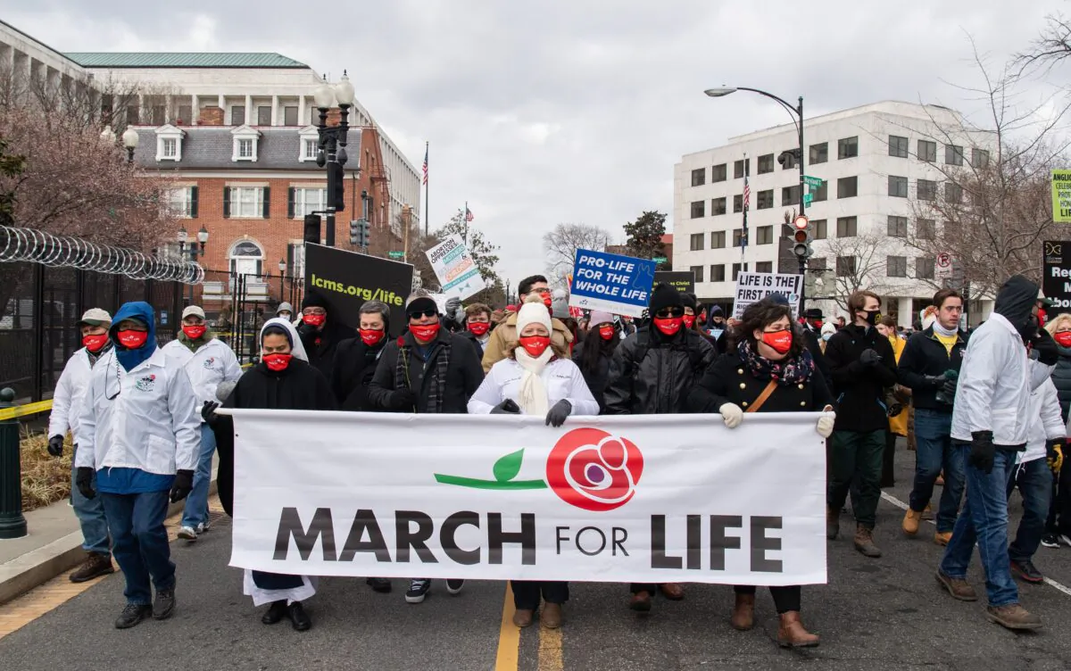 Pro-life activists participate in the "March for Life," an annual event to mark the anniversary of the 1973 Supreme Court case Roe v. Wade, which legalized abortion in the US, outside the US Supreme Court in Washington on Jan. 29, 2021. (Saul Loeb/AFP via Getty Images)