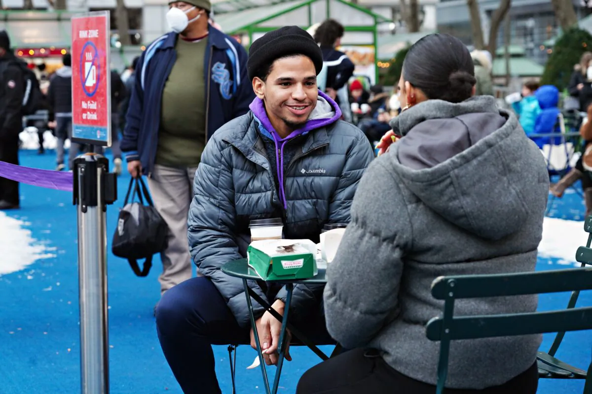 People dine outside at a table in Bryant Park, in New York City, on Dec. 23, 2020. (Cindy Ord/Getty Images)