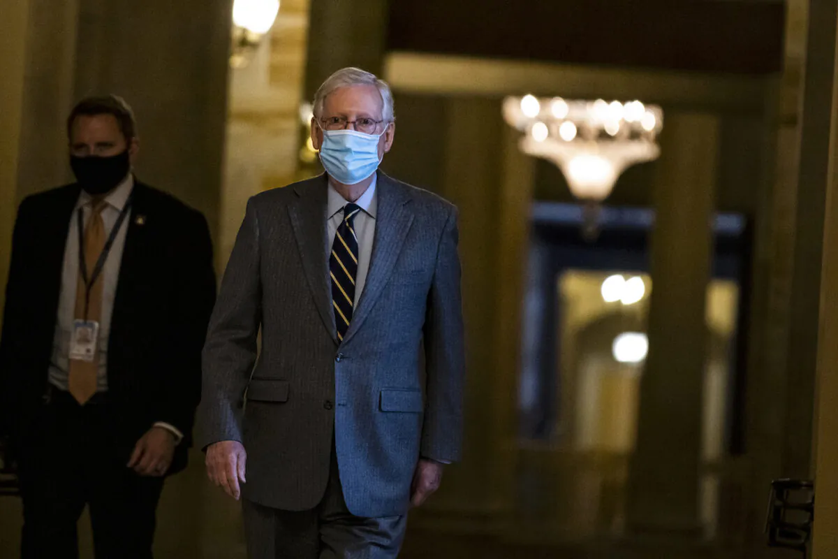 Senate Minority Leader Mitch McConnell (R-Ky.) heads to the floor of the Senate in Washington, on Jan. 26, 2021. (Samuel Corum/Getty Images)