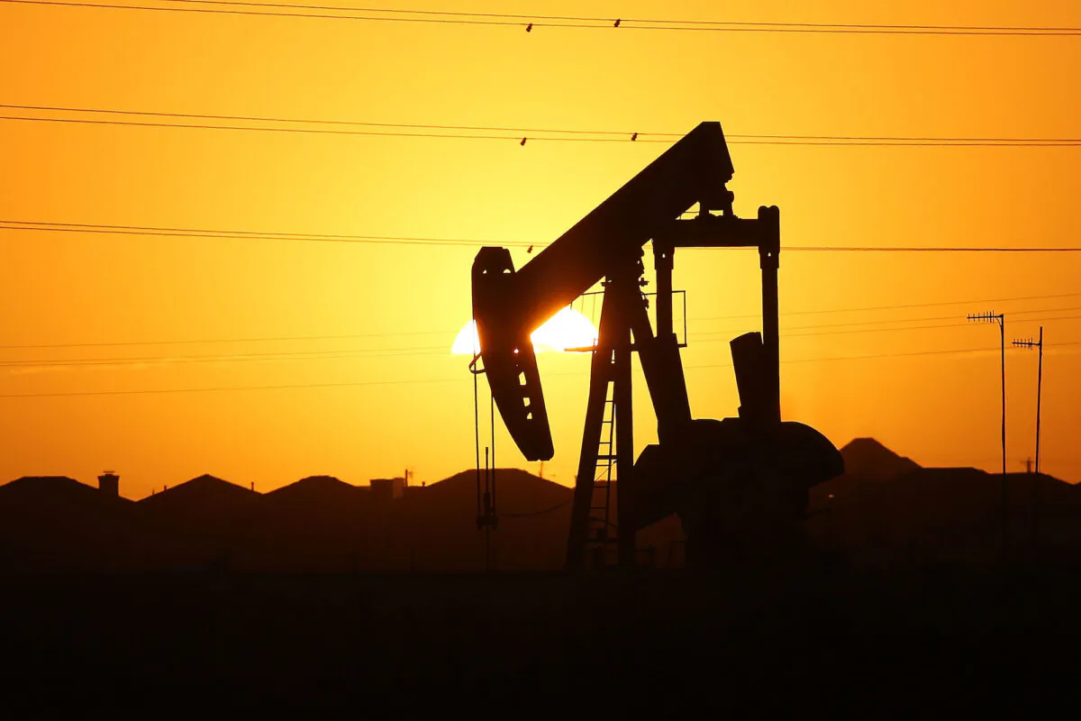 A pumpjack on the outskirts of town at dawn in the Permian Basin oil field in the oil town of Midland, Texas, on Jan. 21, 2016. (Spencer Platt/Getty Images)