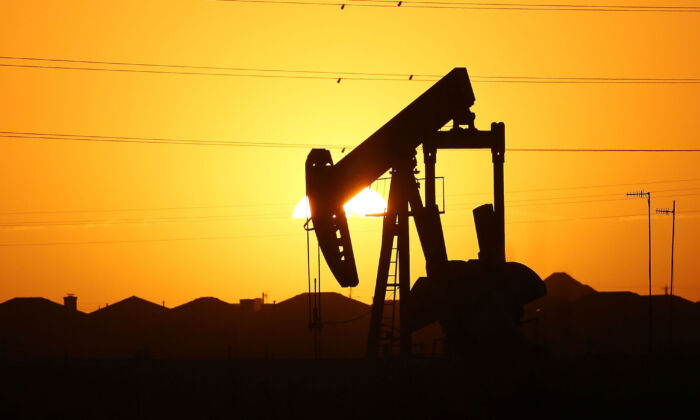 A pumpjack sits on the outskirts of town at dawn in the Permian Basin oil field in the oil town of Midland, Texas, on Jan. 21, 2016. (Spencer Platt/Getty Images)