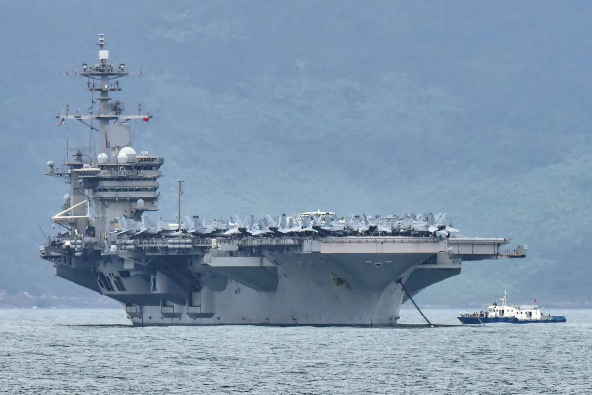 The USS Theodore Roosevelt (CVN-71) is pictured as it enters the port in Da Nang, Vietnam, on March 5, 2020. (Kham/File Photo/Reuters)