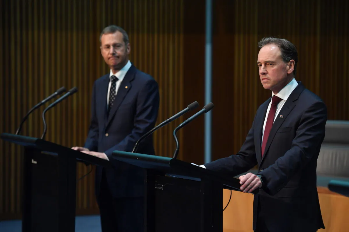 Minister for Health Greg Hunt (R) reacts during a press conference alongside Principle Medical Officer Professor Michael Kidd (L) at Parliament House in Canberra, Australia on March 24, 2020. (Sam Mooy/Getty Images)
