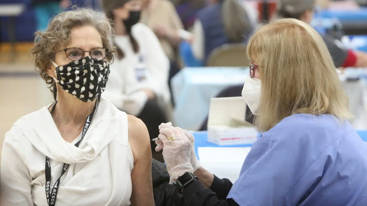 Investigation reveals no specific risk of COVID-19 vaccinations in elderly patients. (Elias Funez/The Union via AP)