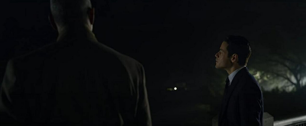 two men on bridge at night in "The Little Things"