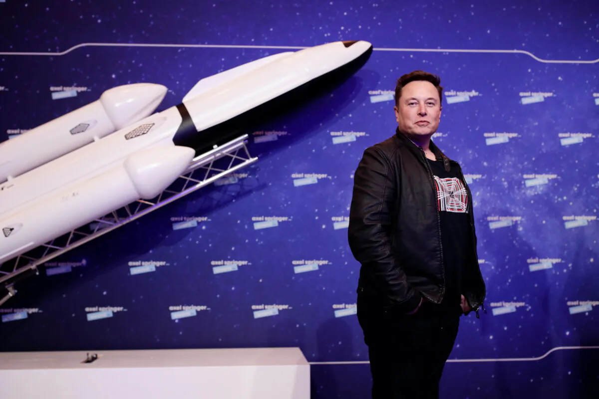 SpaceX owner and Tesla CEO Elon Musk poses after arriving on the red carpet for the Axel Springer award, in Berlin, Germany, on Dec. 1, 2020. (Hannibal Hanschke/Reuters)