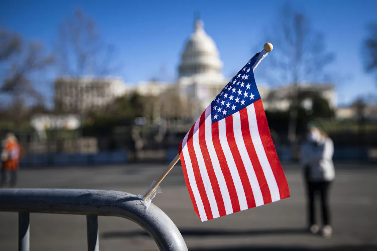An American flag flies near the West Front of the U.S. Capitol in Washington, on Jan. 9, 2021. (Al Drago/Getty Images)