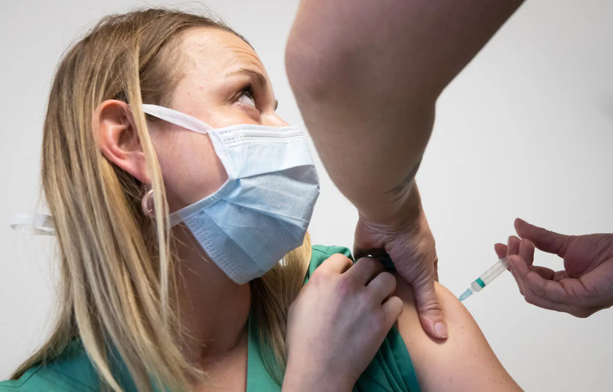 Illustration picture taken during the vaccination with the Moderna vaccine of the staff members of the CHU Tivoli at the CHU Tivoli polyclinic in Binche, Belgium, on Jan. 18, 2021. (Benoit Doppagne/Belga Mag/AFP via Getty Images)