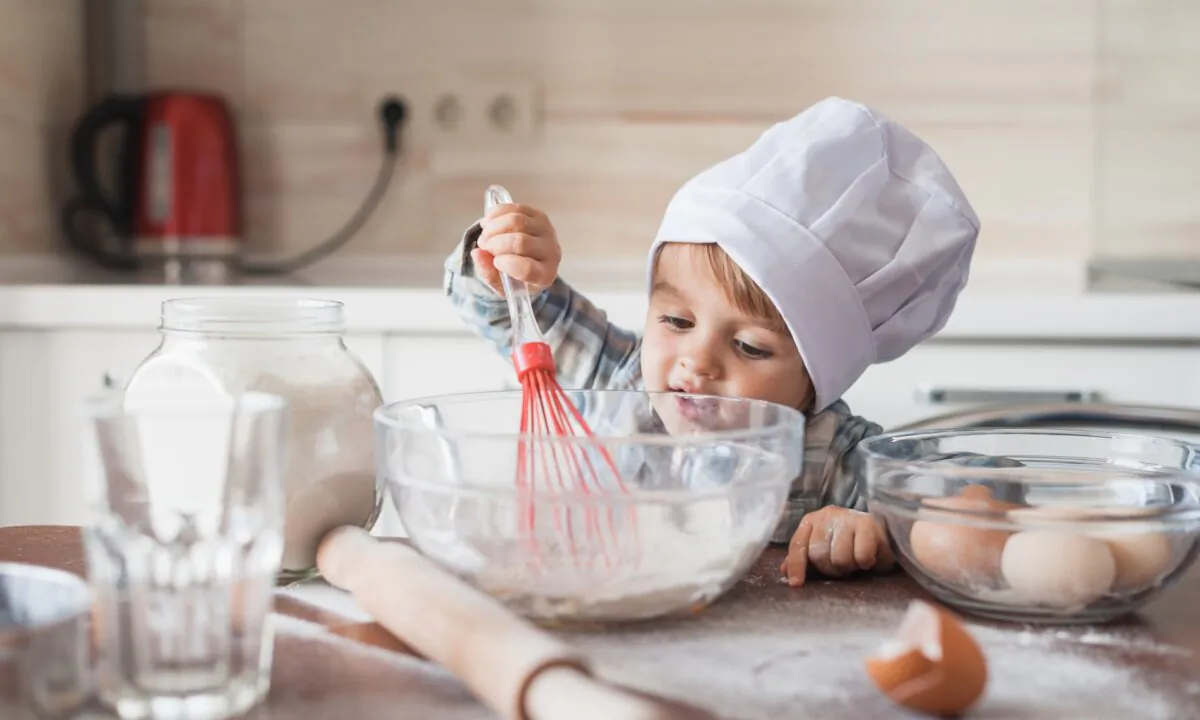 Kitchen tasks like stirring and mixing could help children develop their fine motor skills. (LightField Studios/Shutterstock)
