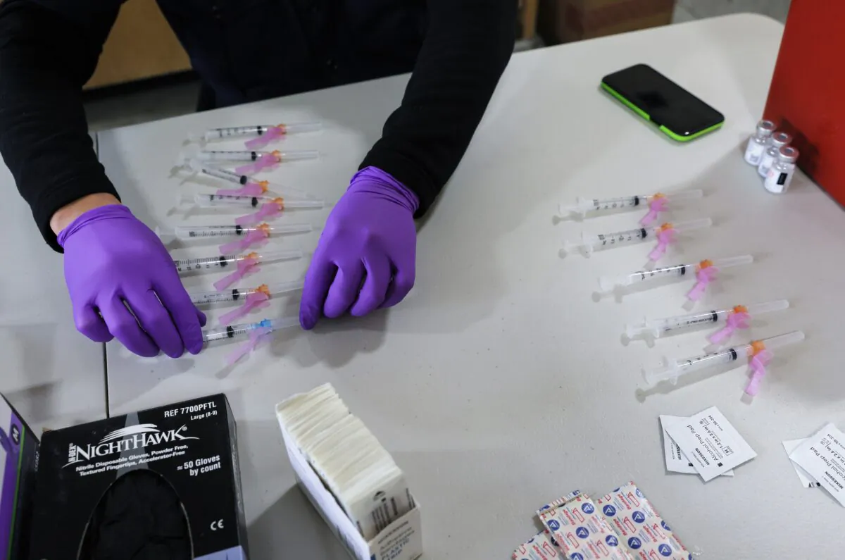 A paramedic prepares doses of a COVID-19 vaccine in Los Angeles on Jan. 29, 2021. (Mario Tama/Getty Images)