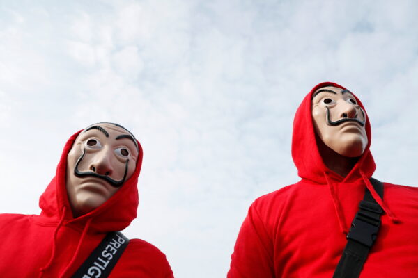 People wearing Salvador Dali masks