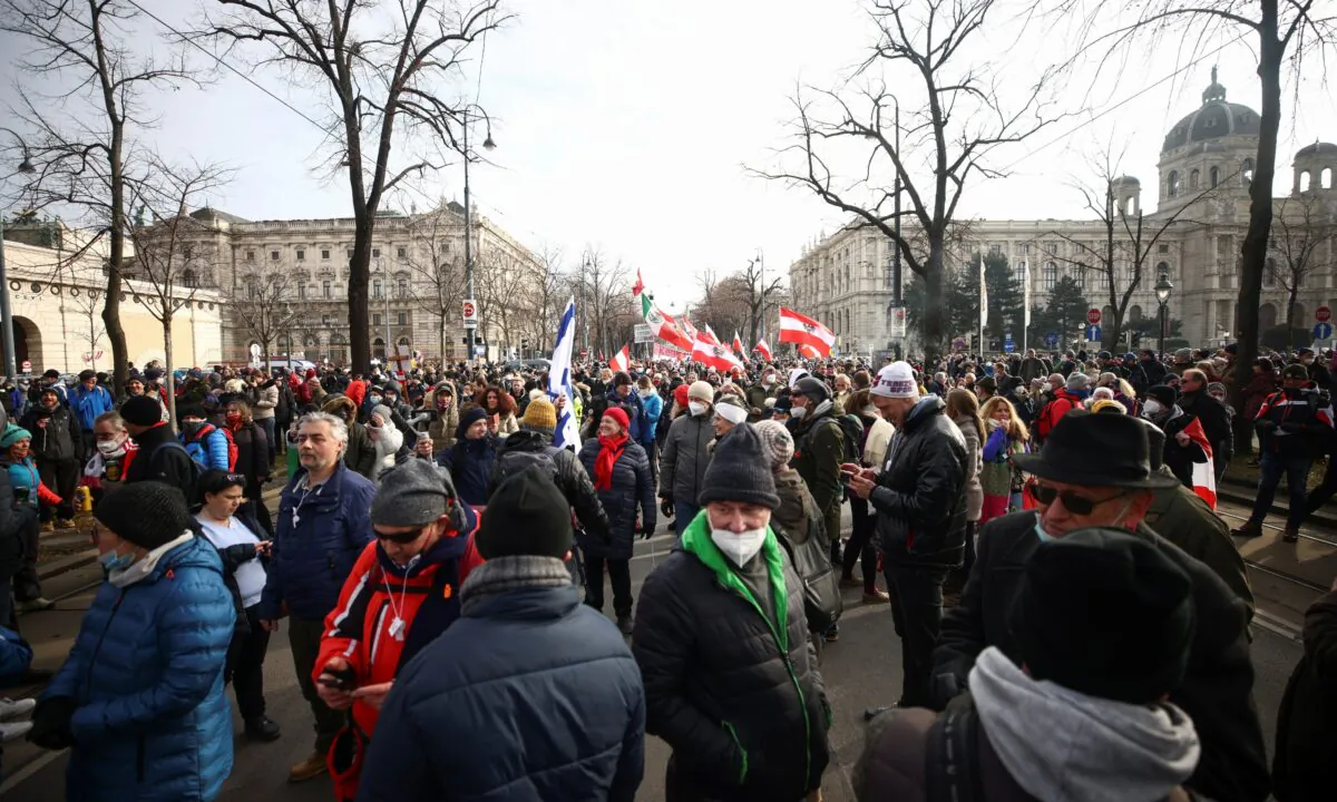 People gather to protest during a demonstration against the coronavirus disease (COVID-19) measures and their economic consequences in Vienna, Austria, on Jan. 31, 2021. (Lisi Niesner/Reuters)