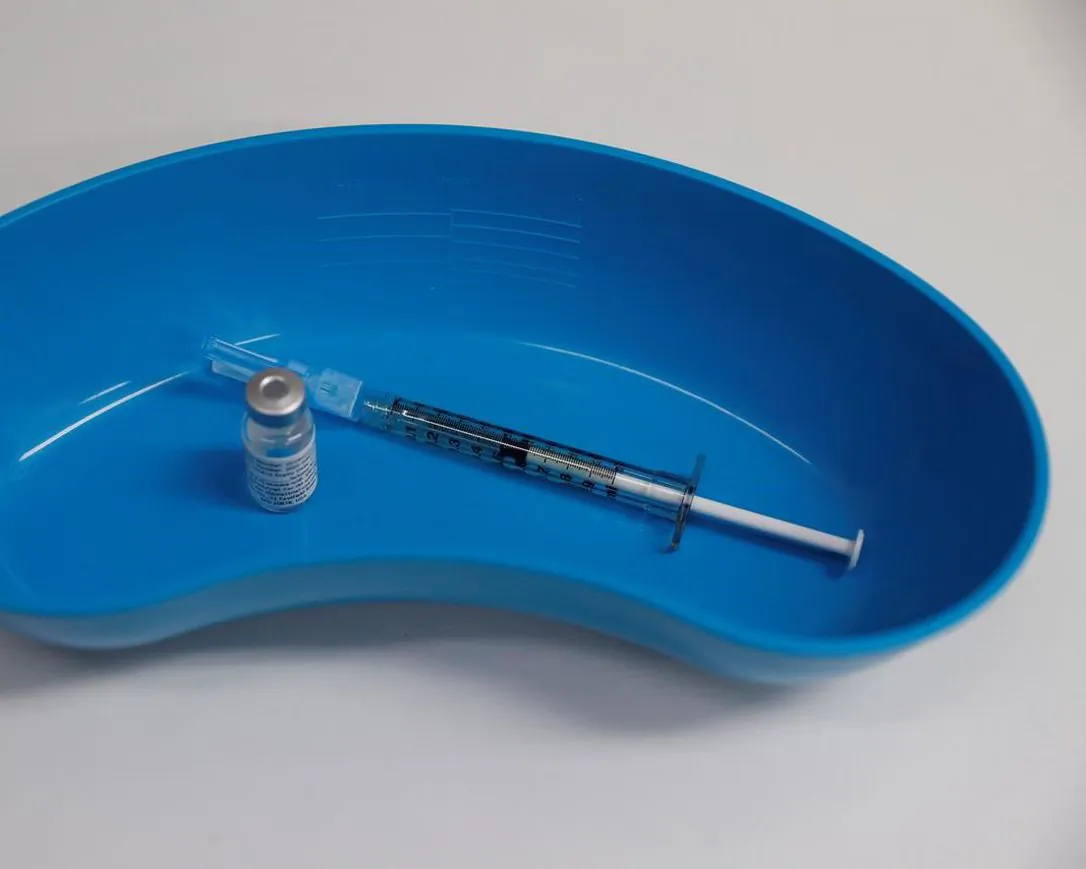 A dose of the Phase 3 Novavax coronavirus vaccine is seen ready for use in the trial at St. George's University hospital in London on October 7, 2020. (Alastair Grant/AP/The Canadian Press) 