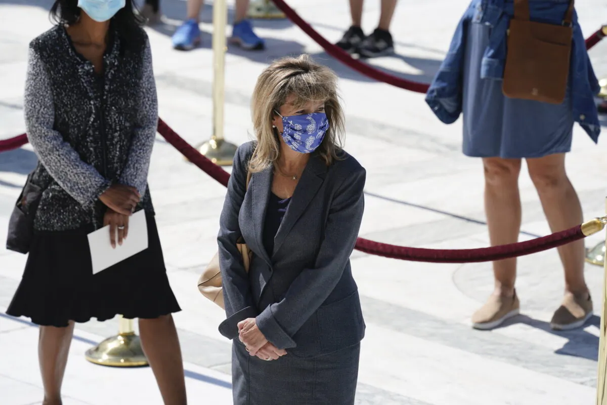 Rep Jackie Speier (D-CA) pays her respects at the casket bearing the remains of Justice Ruth Bader Ginsburg at the steps of the U.S. Supreme Court on September 23, 2020, in Washington. (Alex Brandon-Pool/Getty Images)