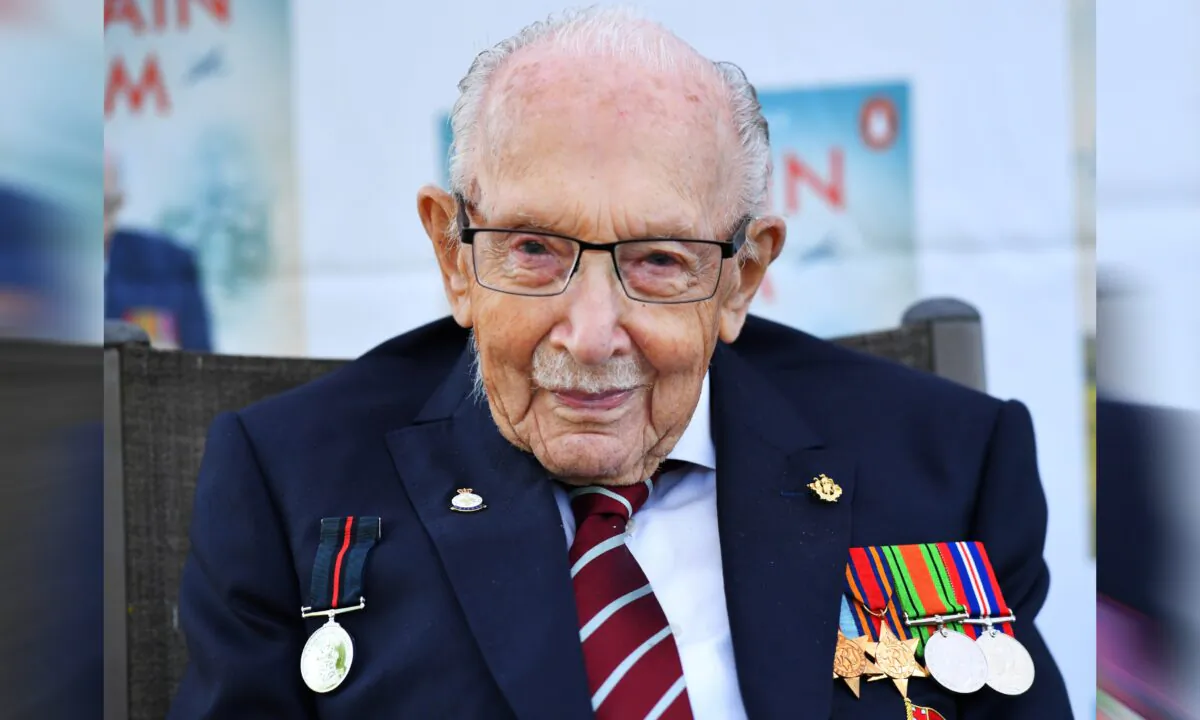 Captain Sir Tom Moore smiles as he launches his autobiography book 'Tomorrow will be a Good Day' at his home in Milton Keynes, Britain, on Sept. 17, 2020. (Dylan Martinez/Reuters)