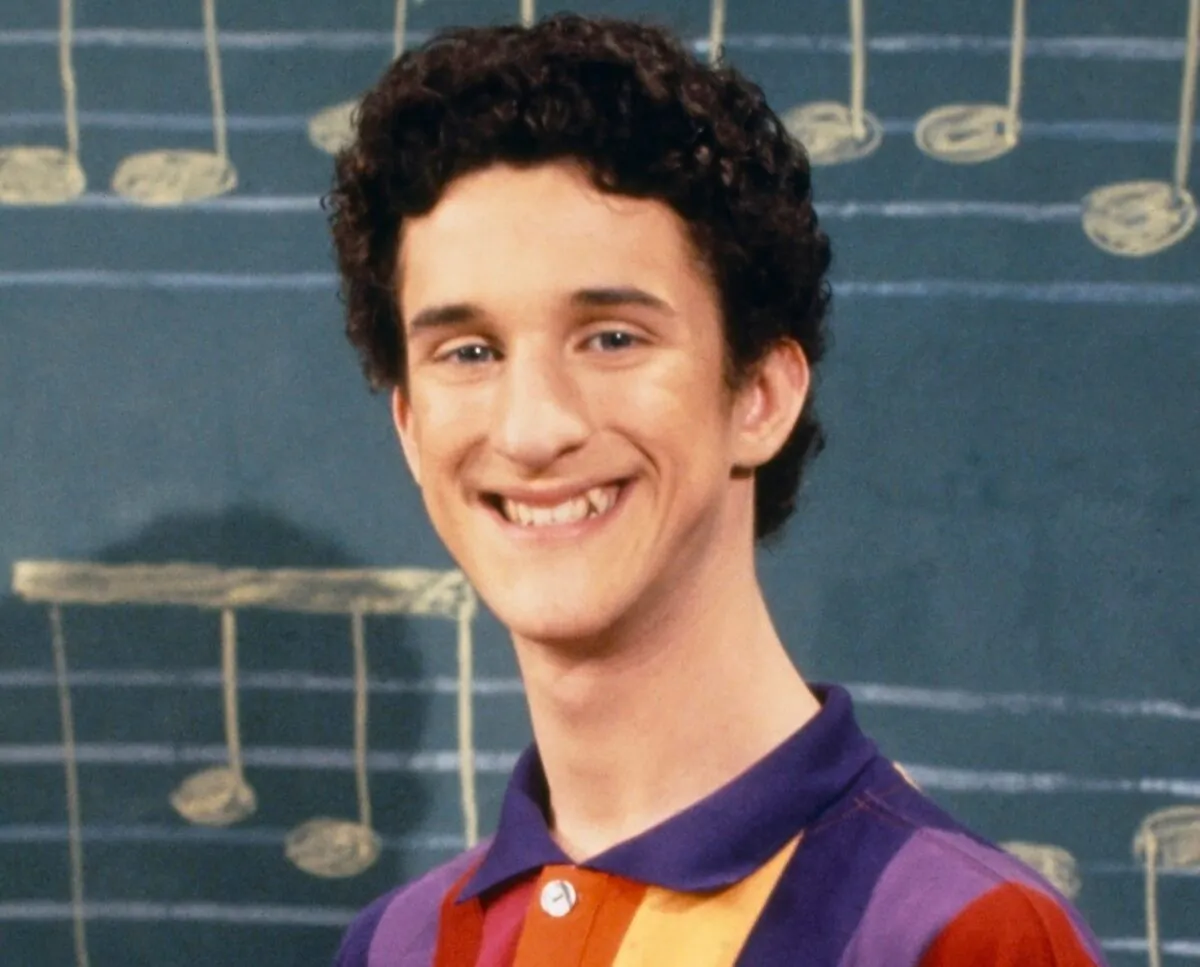 This image released by NBC shows actor Dustin Diamond as Samuel Powers, better known as Screech" from the 1990's series "Saved by the Bell." (Paul Drinkwater/NBCU Photo Bank via AP)