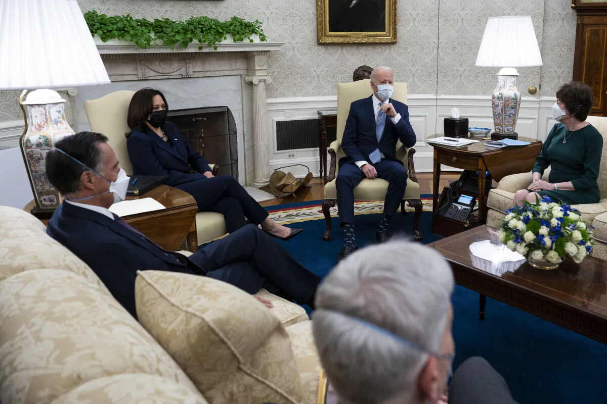 Joe Biden (Center R) and Vice President Kamala Harris (Center L) meet with 10 Republican senators, including Mitt Romney (R-Utah), Bill Cassidy (R-La.) and Susan Collins (R-Maine), in the Oval Office at the White House in Washington, on Feb. 1, 2021. (Doug Mills-Pool/Getty Images)