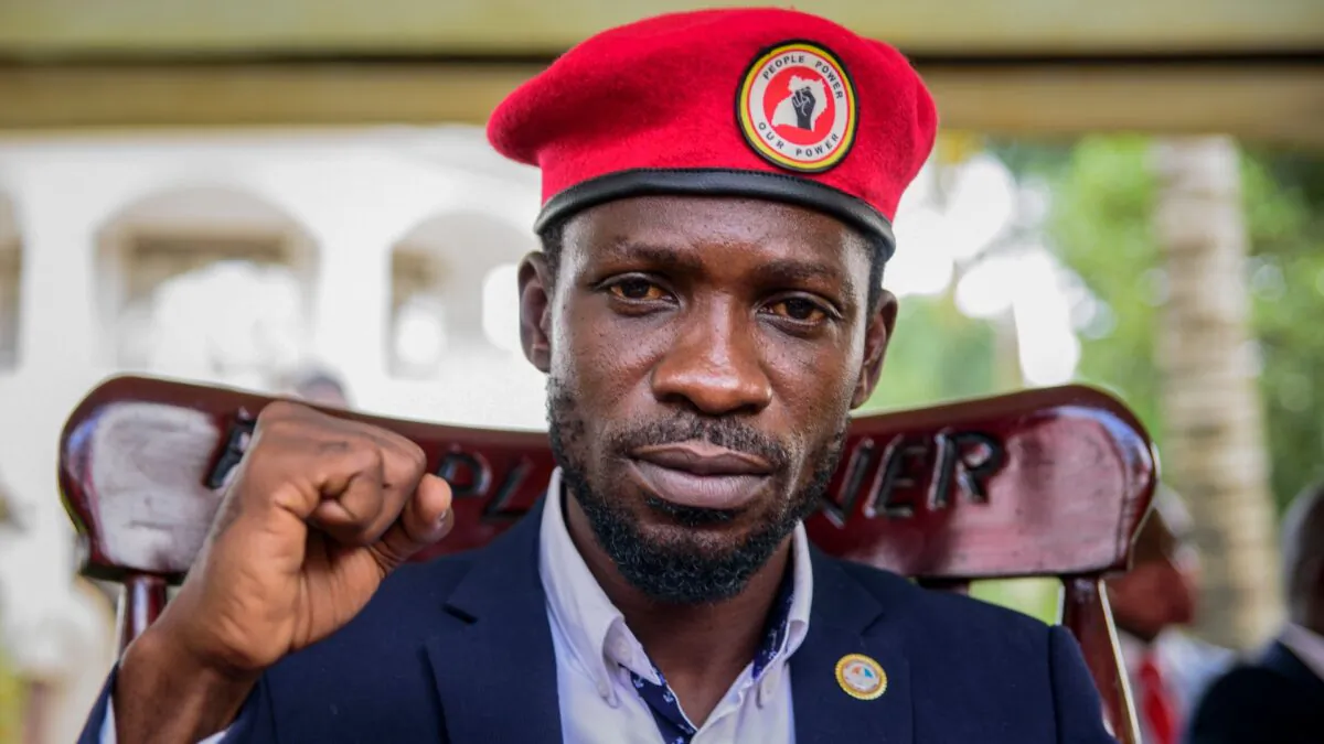 Opposition presidential challenger Bobi Wine gestures as he speaks to the media outside his house, in Magere, Uganda, on Jan. 26, 2021. (Nicholas Bamulanzeki/AP Photo)