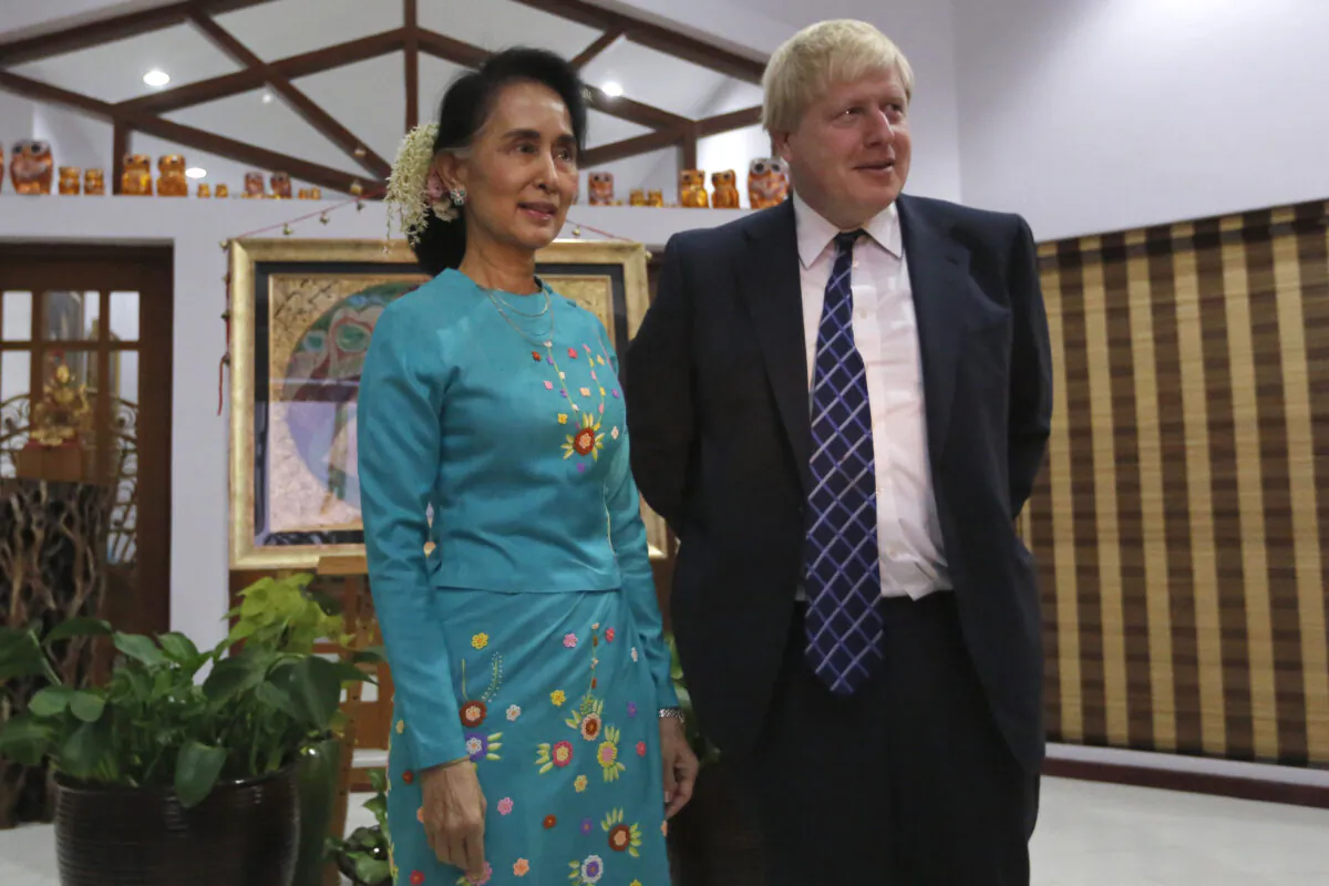 Burma’s State Counsellor and Foreign Minister Aung San Suu Kyi (L) welcomes then-British Foreign Secretary Boris Johnson (R) in Naypyidaw, Burma, on Jan. 20, 2017. (Soe Zeya Tun/AFP via Getty Images)
