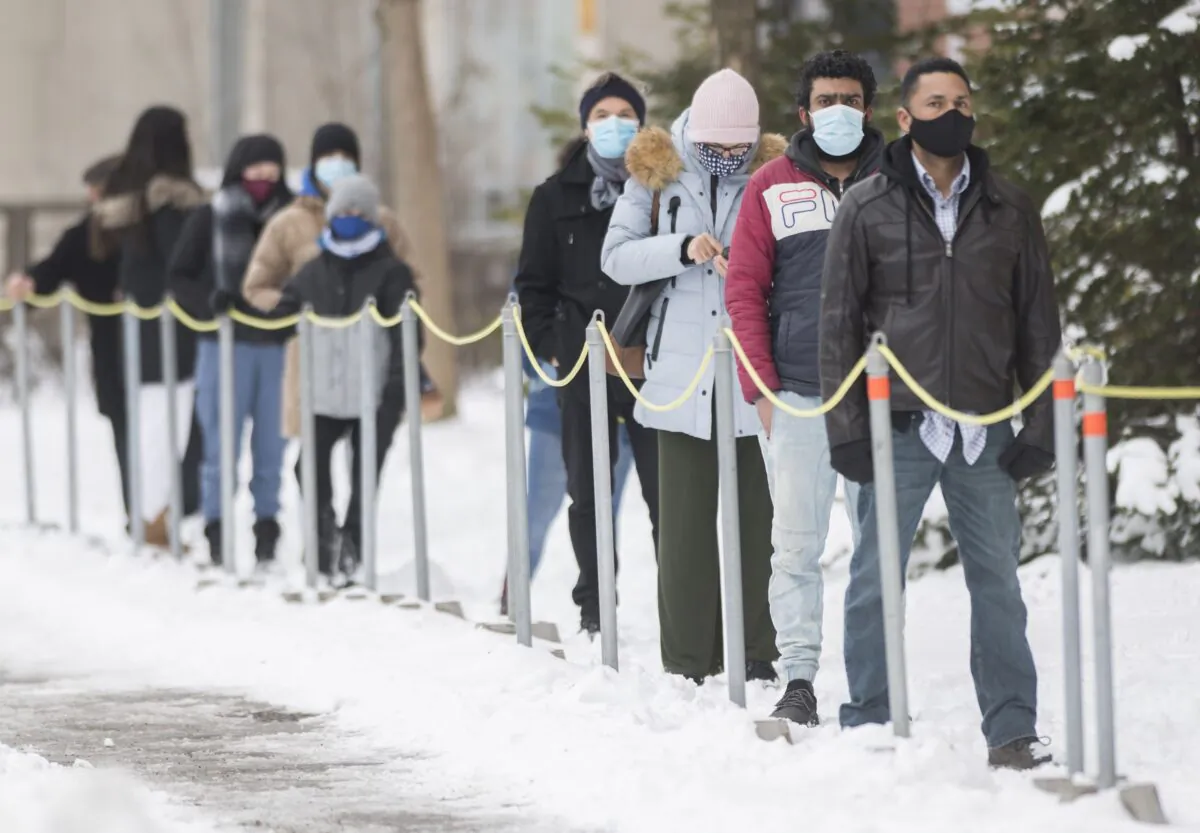 People wait to be tested for COVID-19 at a clinic in Montreal on Jan. 3, 2021. (The Canadian Press/Graham Hughes)