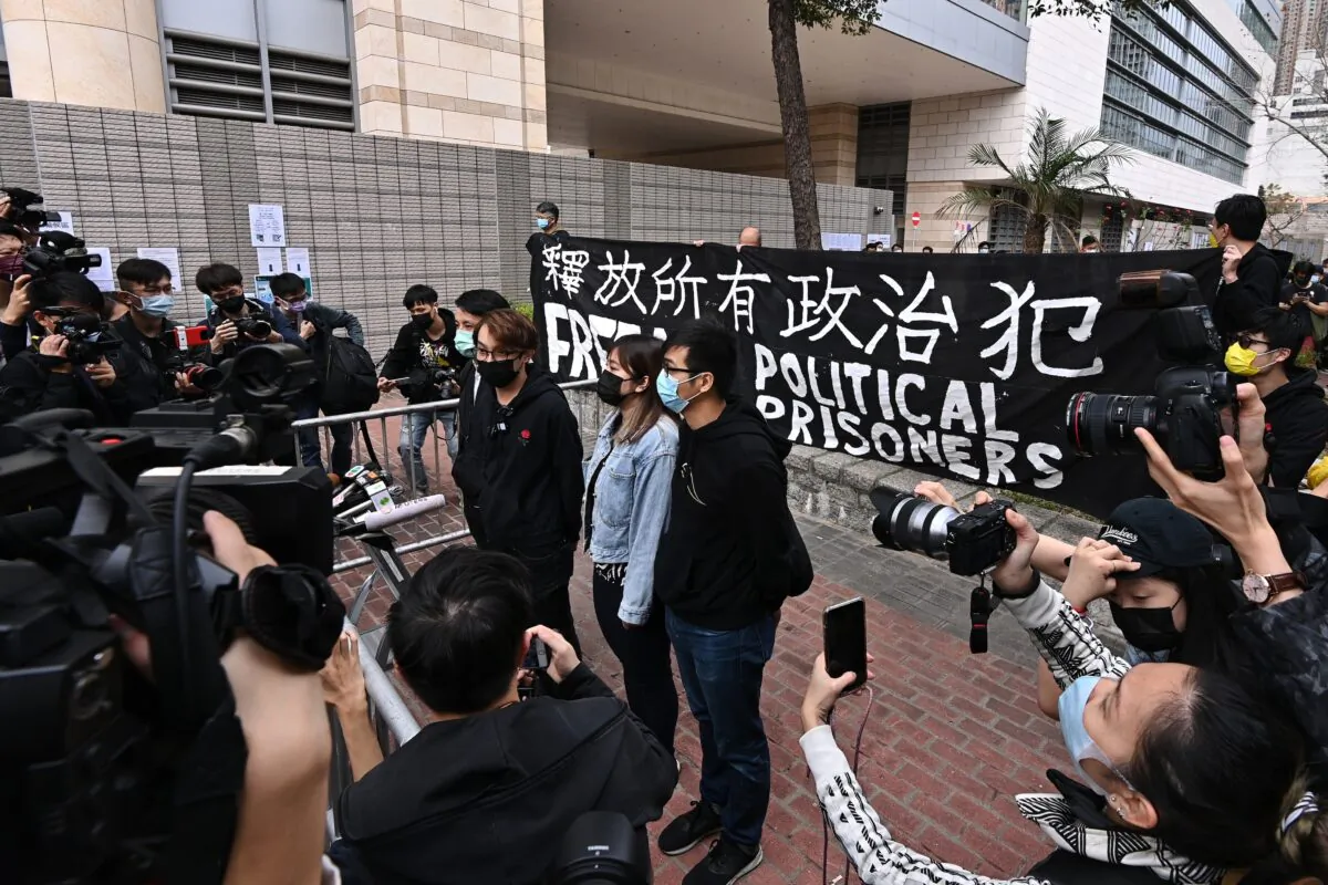 Figo Chan (3rd R), the convener of the pro-democracy group Civil Human Rights Front, speaks to the media outside of the West Kowloon Magistrates’ Court in Hong Kong on March 1, 2021. (Sung Pi-lung/The Epoch Times)