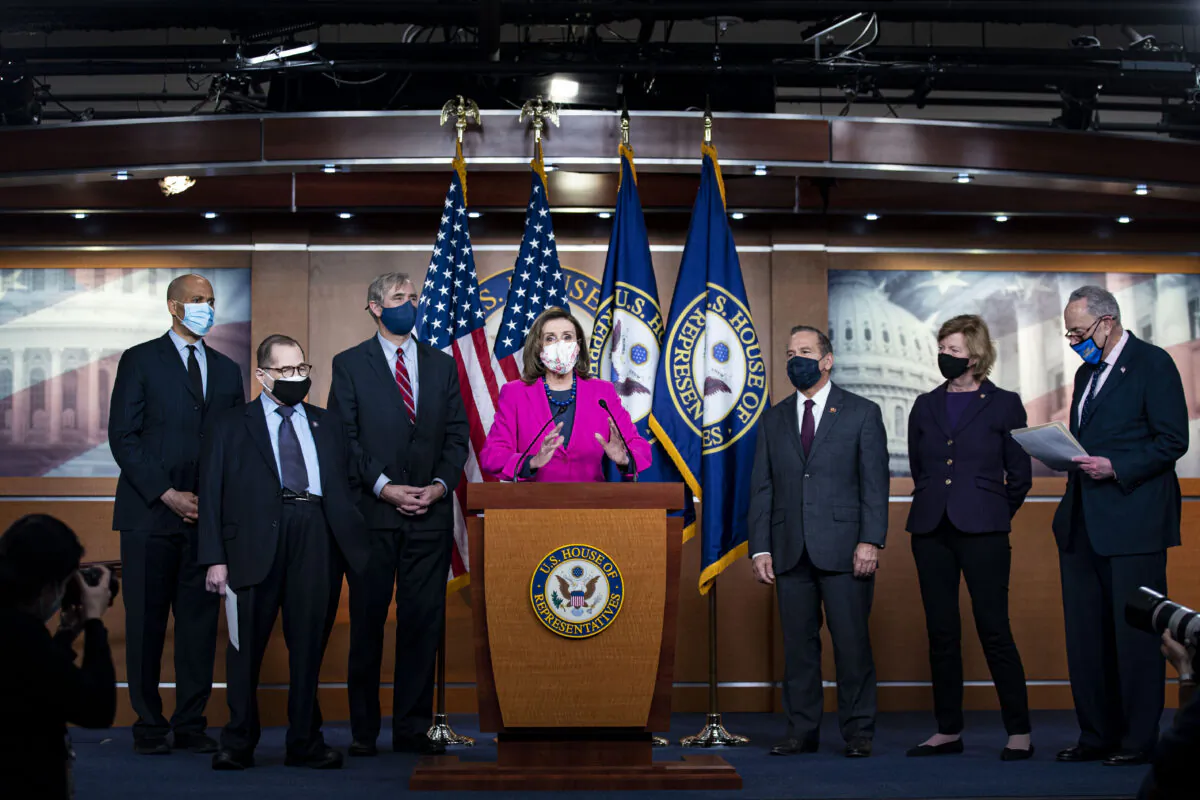 House Speaker Rep. Nancy Pelosi (D-Calif.) speaks as Sen. Cory Booker (D-N.J.), Rep. Jerrold Nadler (D-N.Y.), Sen. Jeff Merkley (D-Ore.) (L), Rep. David Cicilline (D-R.I.), Sen. Tammy Baldwin (D-Wis.), Senate Majority Leader Charles Schumer (D-N.Y.) (R) listen during a news conference ahead of the House vote on the Equality Act on Capitol Hill in Washington on Feb. 25, 2021. (Al Drago/Getty Images)