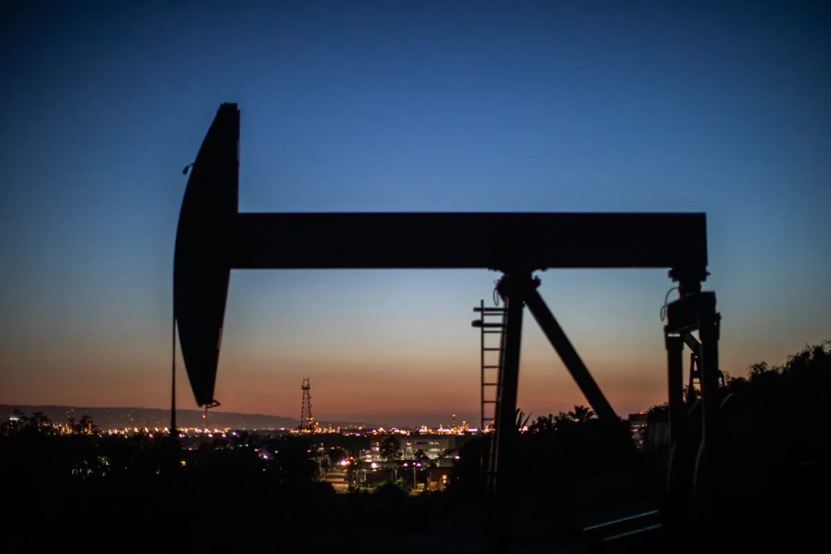 An oil pumpjack operates at dusk Willow Springs Park in Long Beach, Calif., on April 21, 2020. (Apu Gomes/AFP via Getty Images)