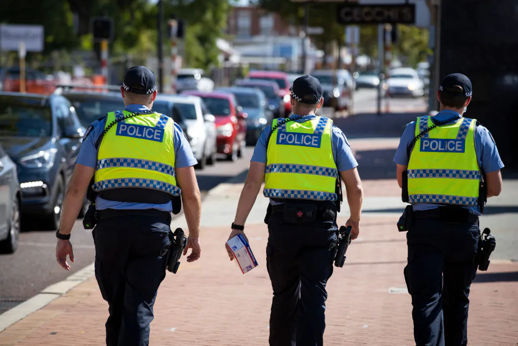 Police are seen on patrol at a COVID-19 drive through clinic in Inglewood where members of the public have been waited over two hours in line on Feb. 1, 2021 in Perth, Australia. (Matt Jelonek/Getty Images)