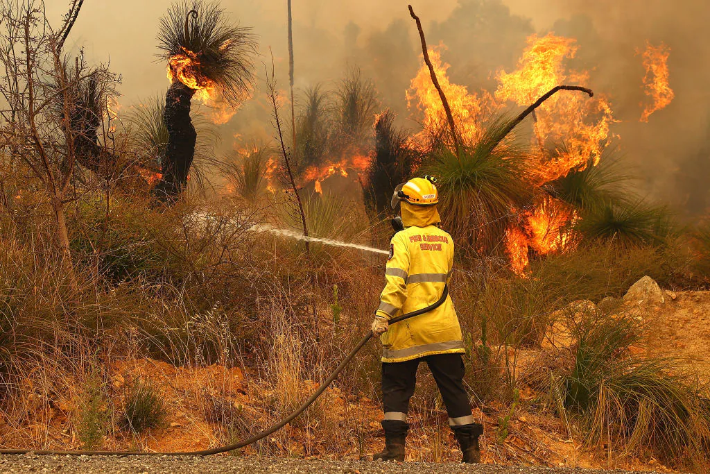 Fire crews control bush fires as they approach properties on Copley Road in Upper Swan in Perth, Australia, on Feb. 2, 2021. (Paul Kane/Getty Images)