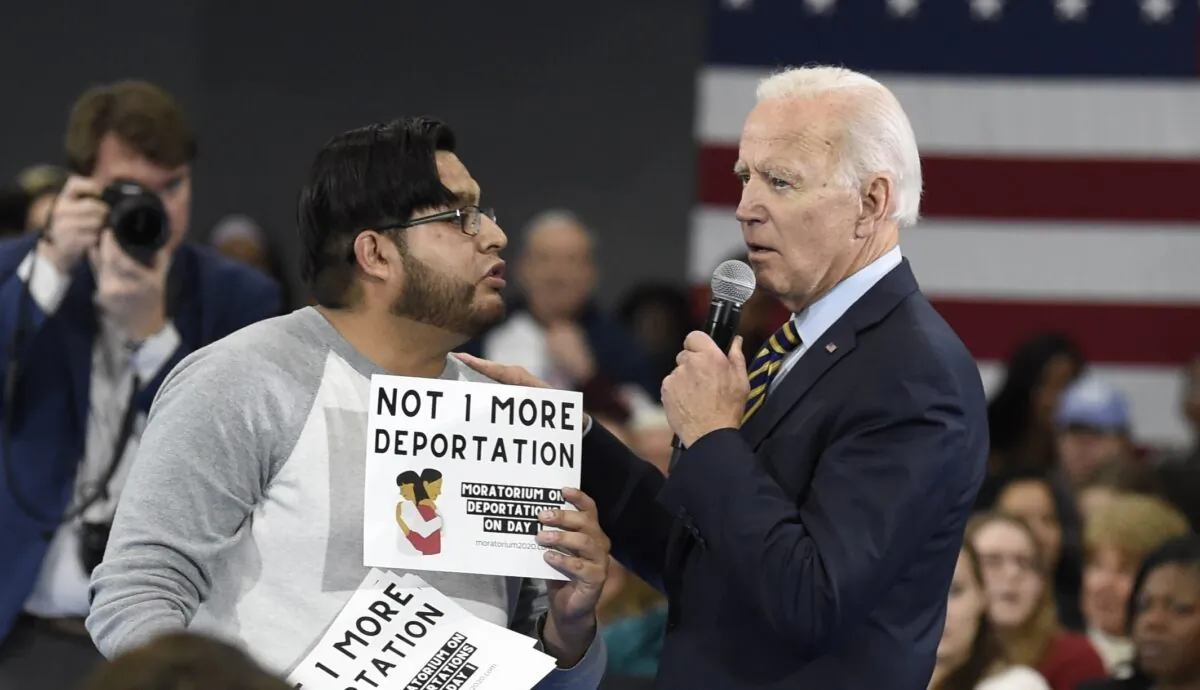 A protester objects to then-presidential candidate Joe Biden’s stance on deportations during a town hall at Lander University in Greenwood, S.C., on Nov. 21, 2019. (Meg Kinnard/AP Photo)