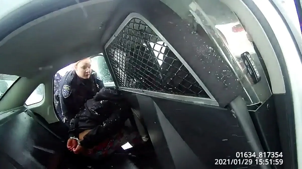 Bodycam footage as a Rochester police officer asks a handcuffed nine-year-old girl to get into a patrol car in Rochester, New York, on Jan. 29, 2021. (Rochester Police Department/Handout via Reuters)