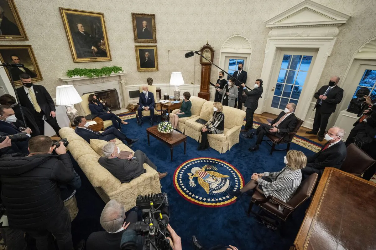 President Joe Biden and Vice President Kamala Harris meet with 10 Republican senators, including Sens. Mitt Romney (R-Utah), Bill Cassidy (R-La.), Susan Collins (R-Maine), and Lisa Murkowski (R-Alaska), in the Oval Office at the White House in Washington on Feb. 1, 2021. (Doug Mills/Pool/Getty Images)