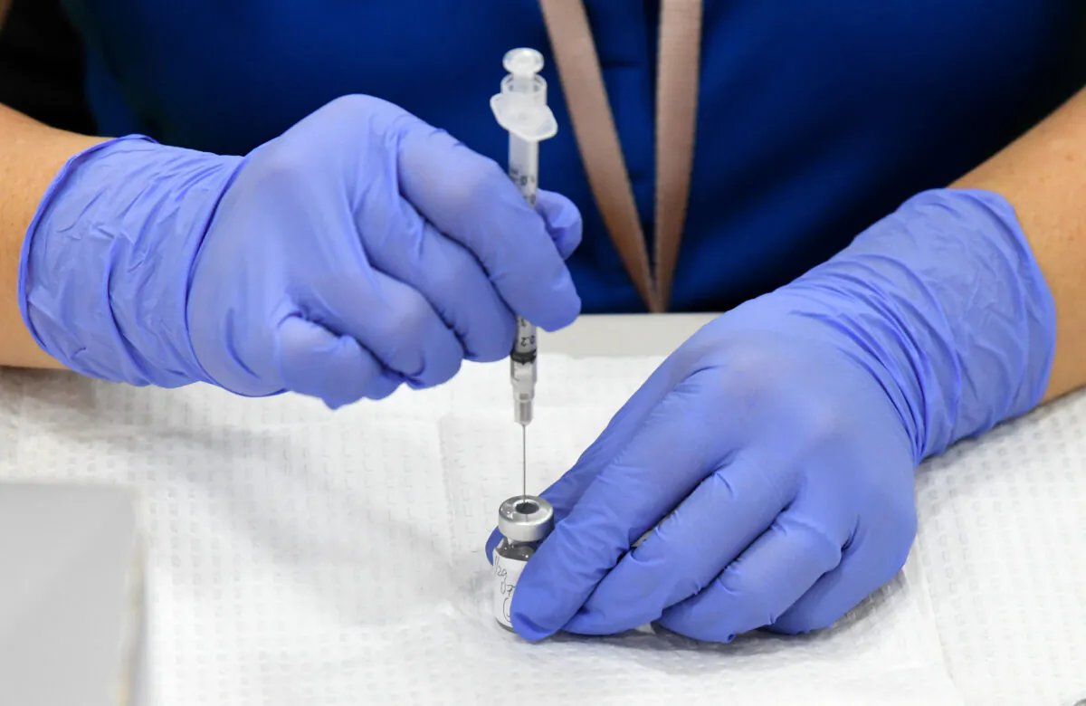 A nurse prepares a Pfizer COVID-19 vaccine for administration at Jerome Mack Middle School in Las Vegas on Jan. 29, 2021. (Ethan Miller/Getty Images)