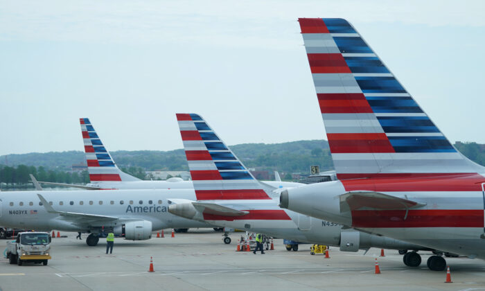 American Airlines jets made by Embraer and other manufacturers sit at gates at Washington's Reagan National Airport amid the coronavirus pandemic, in Washington on April 29, 2020. (Kevin Lamarque/Reuters)