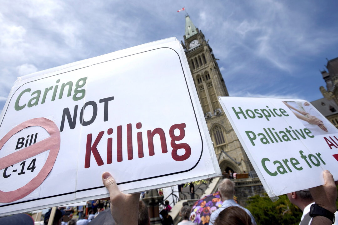 People rally against Bill C-14, the medically assisted dying bill, during a protest organized by the Euthanasia Prevention Coalition on Parliament Hill in Ottawa on June 1, 2016. (Justin Tang/The Canadian Press)