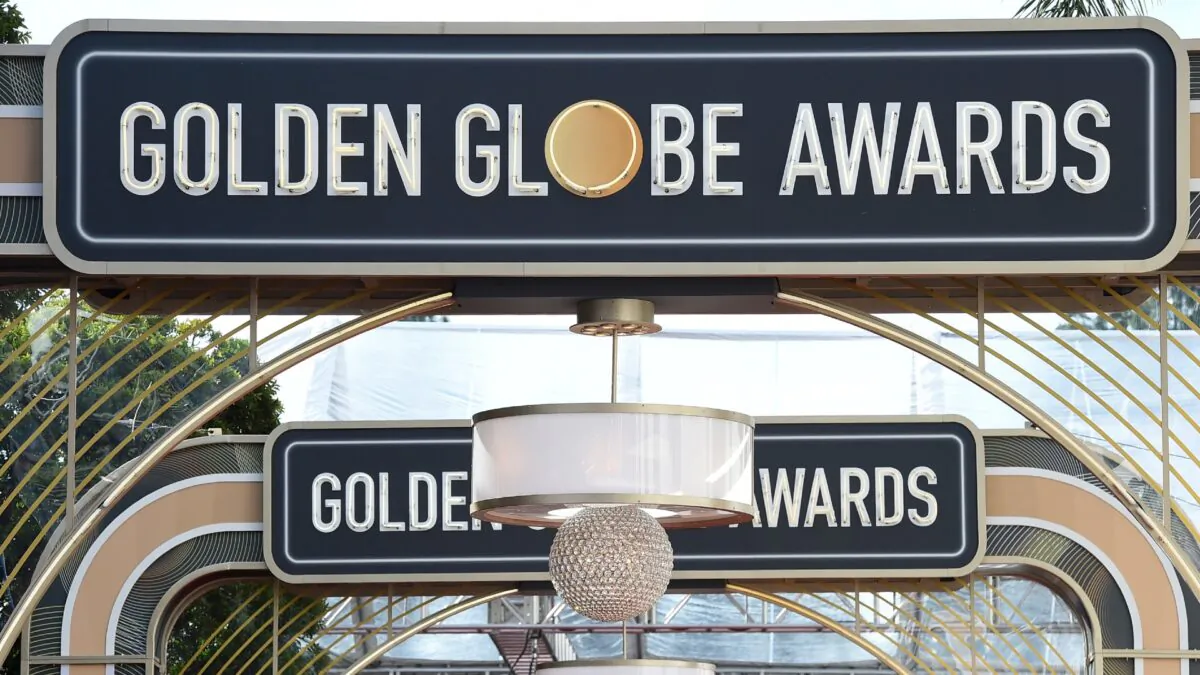 Event signage appears above the red carpet at the 77th annual Golden Globe Awards in Beverly Hills, Calif., on Jan. 5, 2020. (Jordan Strauss/Invision/AP)