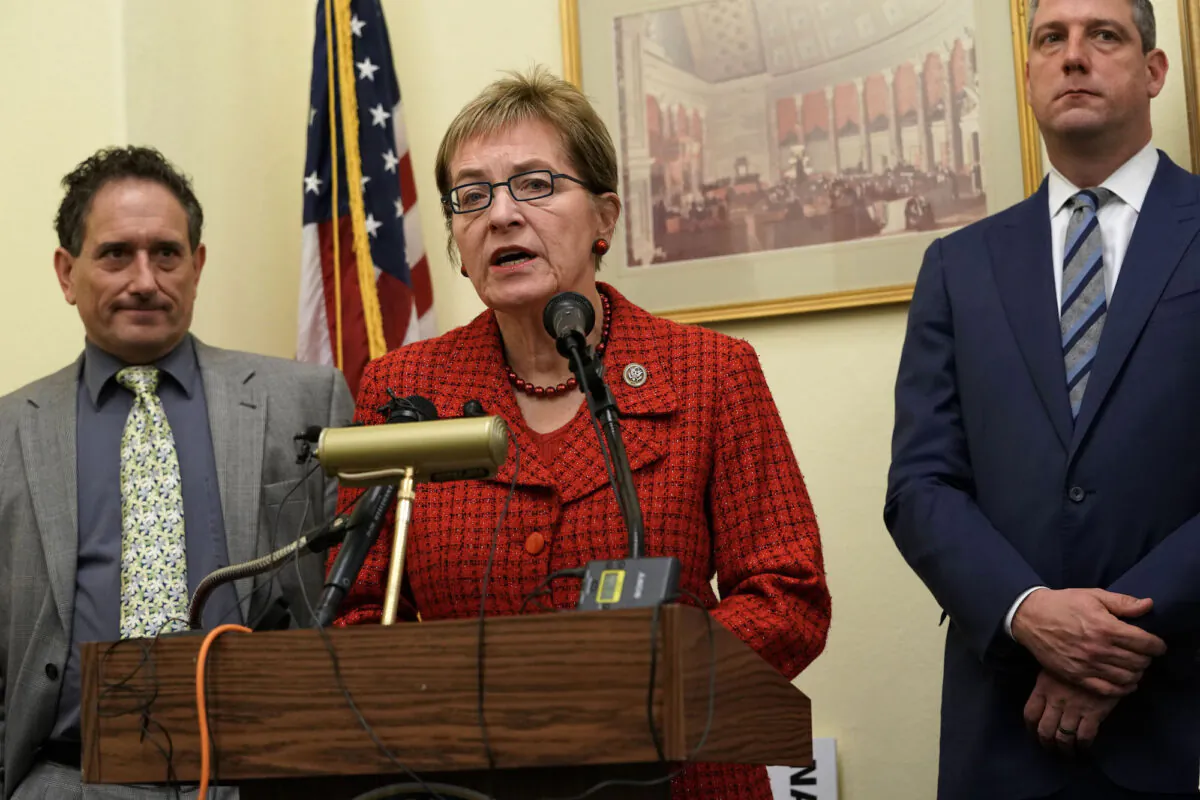 Rep. Marcy Kaptur (D-Ohio) speaks as then Rep.-elect Andy Levin (D-Mich.) (L), and Rep. Tim Ryan (D-Ohio) (R) listen during a news conference in Washington, on Nov. 29, 2018. (Alex Wong/Getty Images)