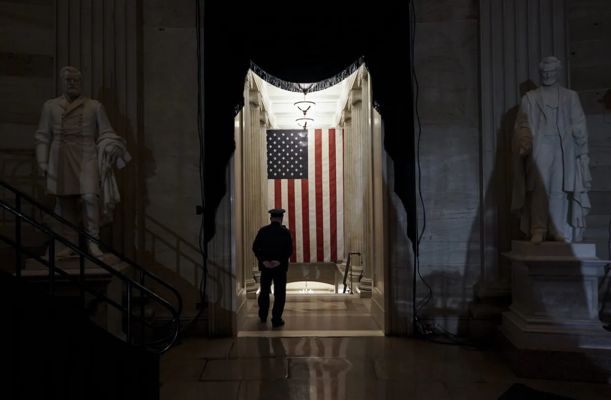 A U.S. Capitol Police officer stands at the door of the Capitol Rotunda near where the late U.S. Capitol Police officer Brian Sicknick will lie in honor in Washington, Feb. 2, 2021. (Salwan Georges/The Washington Post via AP, Pool)