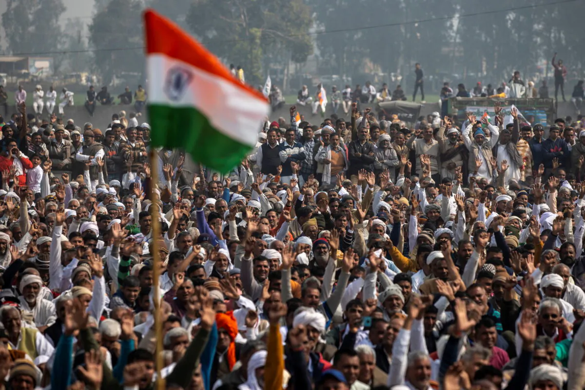 People attend a Maha Panchayat or grand village council meeting as part of a farmers' protest against farm laws at Kandela village in Jind district in the northern state of Haryana, India, Feb. 3, 2021. (Danish Siddiqui/Reuters)