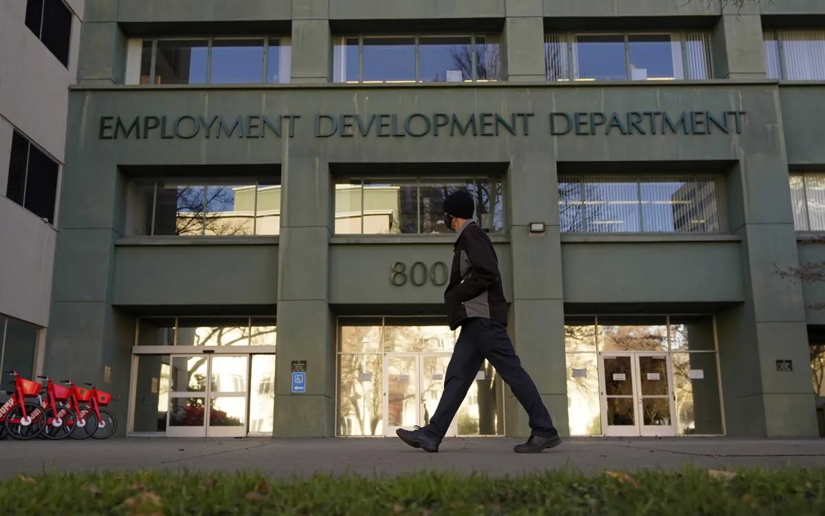 A person walks past the office of the California Employment Development Department in Sacramento, Calif., on Dec. 18, 2020. (Rich Pedroncelli/AP Photo)