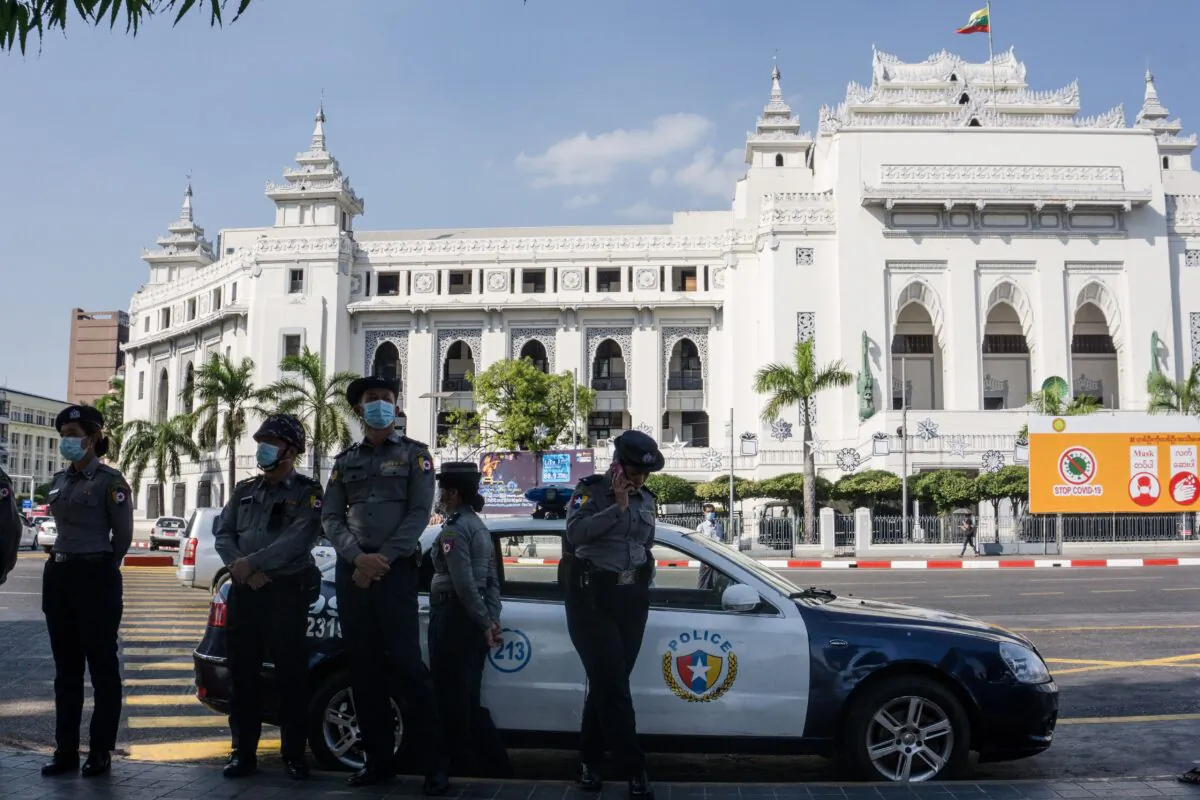 Police stand guard on a street in Yangon, Burma on Feb. 4, 2021, days after a military coup. (STR/AFP via Getty Images)
