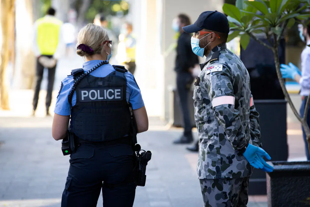 A member of the police and Reserves are seen at a Covid-19 quarantine hotel on January 31, 2021 in Perth, Australia. (Matt Jelonek/Getty Images)