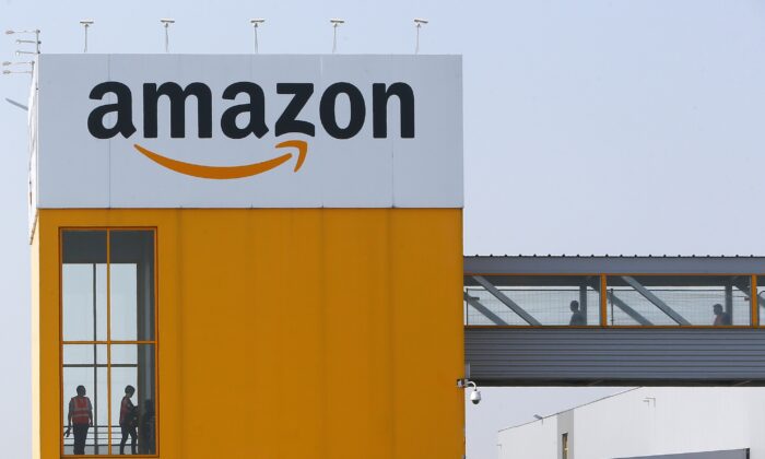 Amazon workers are seen at a facility in Douai, France on Feb. 2, 2021. (Michael Spingler/AP Photo)