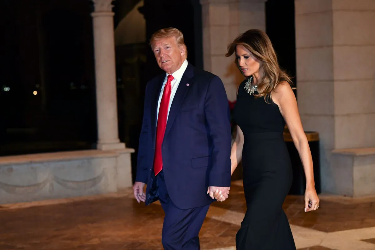 Then-President Donald Trump and First Lady Melania Trump arrive for a Christmas Eve dinner with their family at Mar-a-Lago in Palm Beach, Fla., on Dec. 24, 2019. (Nicholas Kamm/AFP via Getty Images)
