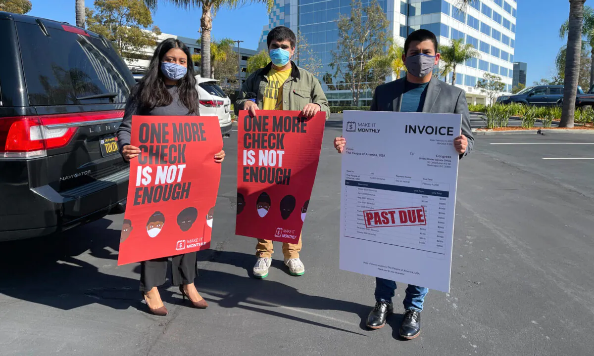Community activists prepare to deliver petitions to Rep. Katie Porter (D-California) calling for monthly stimulus checks in Irvine, Calif., on Feb. 4, 2021. (Drew Van Voorhis/The Epoch Times)